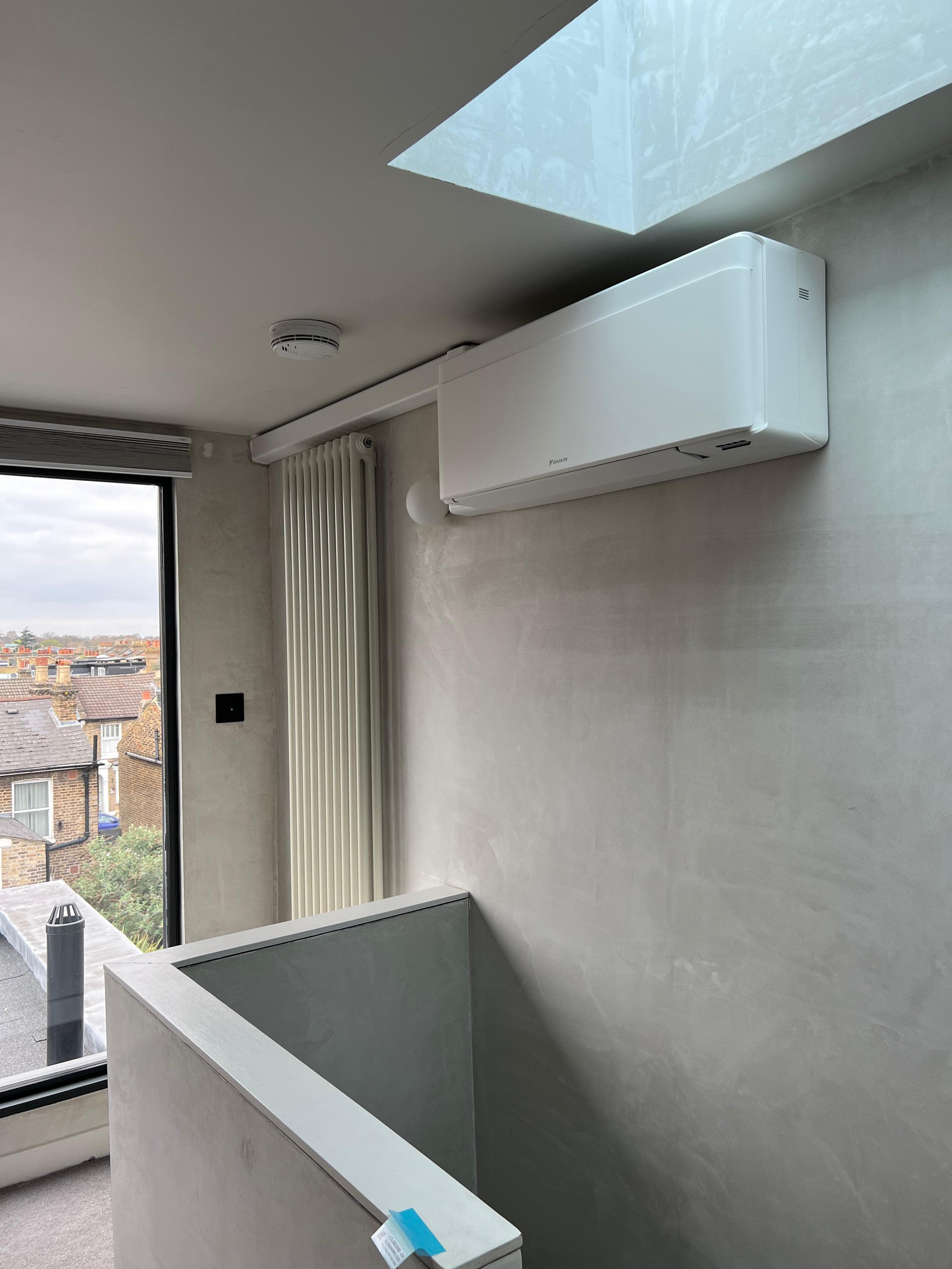 Air conditioning unit installed in a loft conversion space