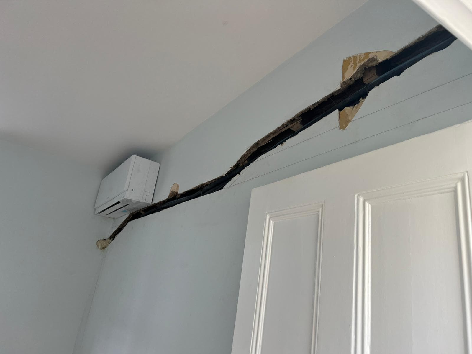 Building work during AC fit-out - wall penetration detail