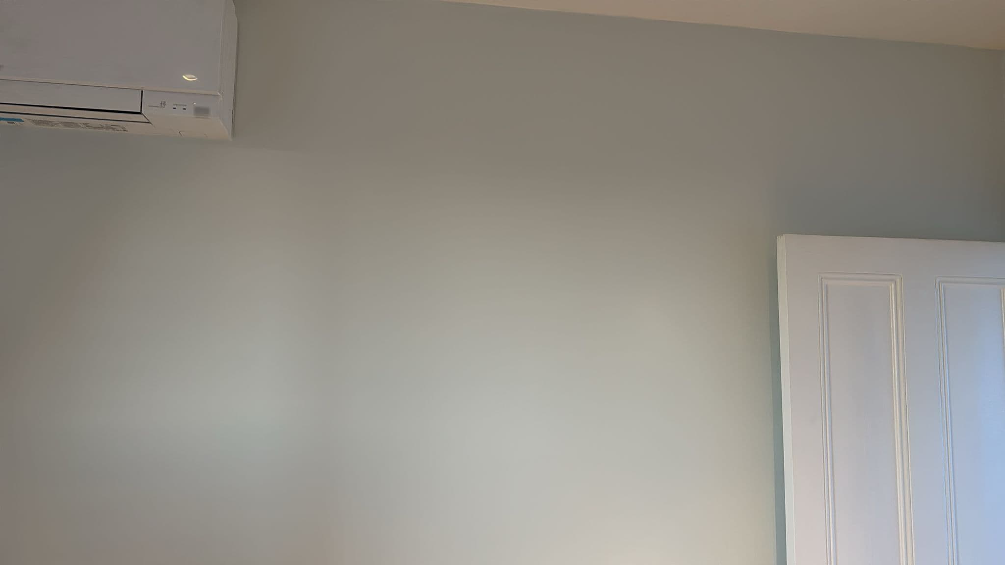 Engineer carrying out building work for AC installation