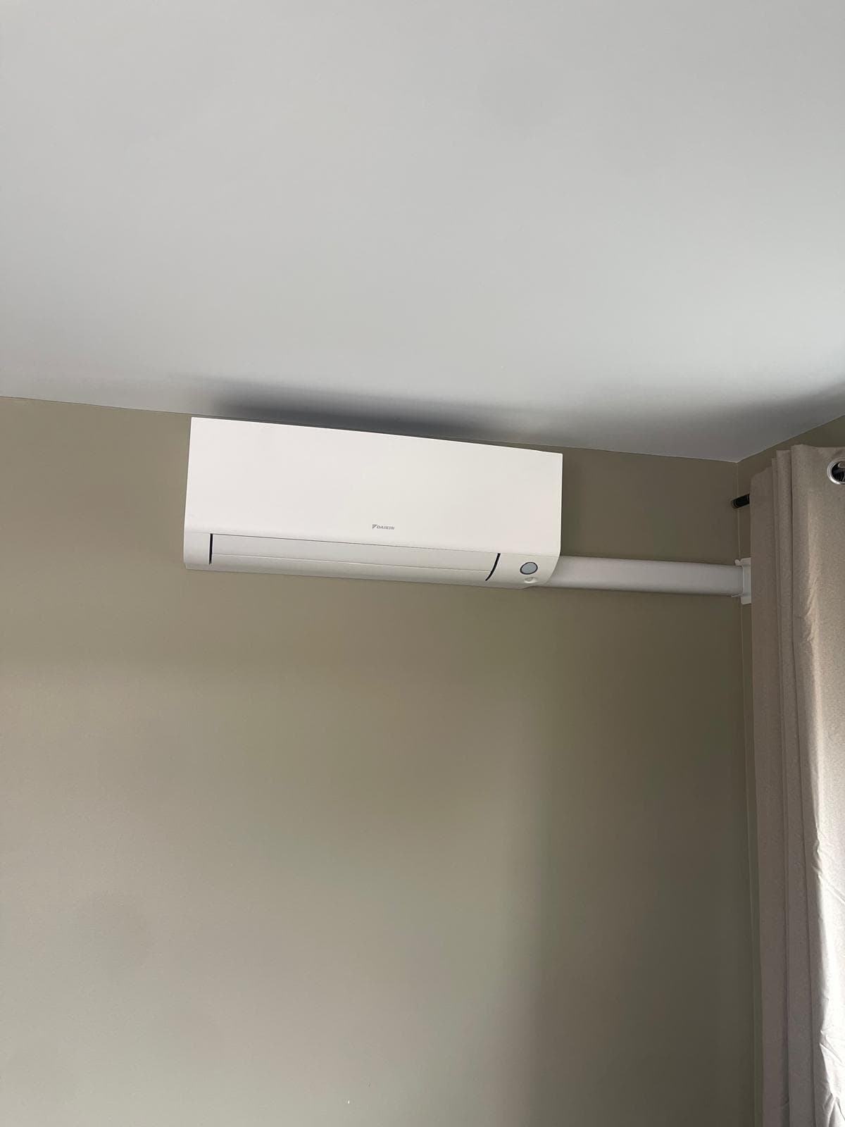 Daikin Perfera installed with white trunking channel