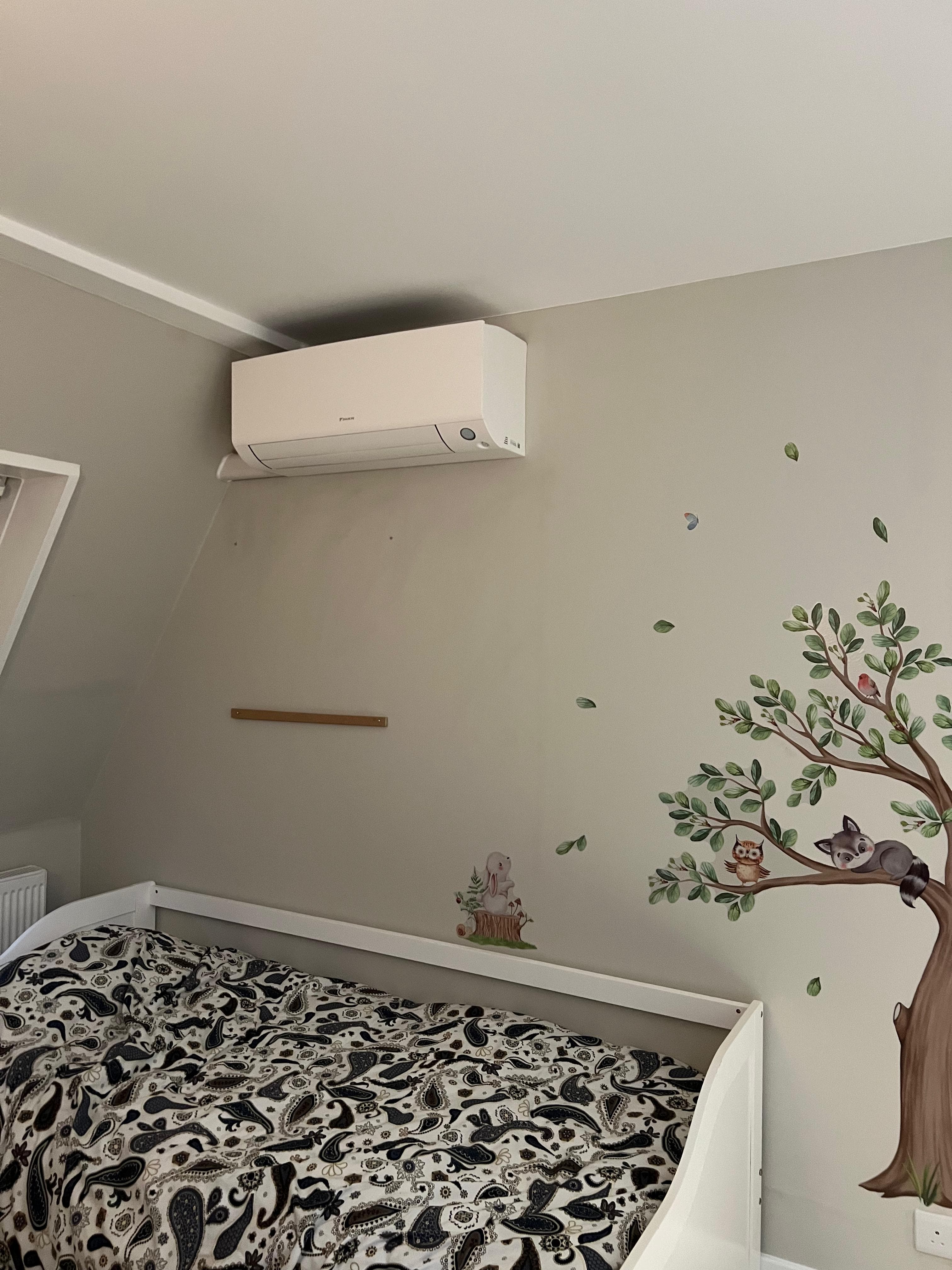 Daikin Perfera with white trunking - neat pipework finish