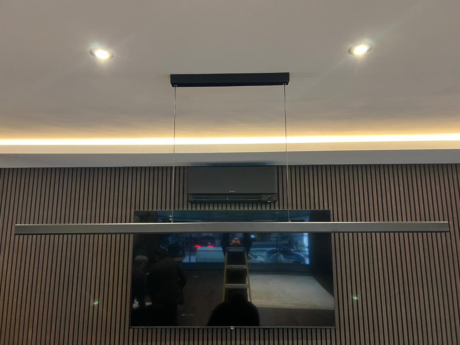 Daikin Stylish black unit installed against a dark accent wall