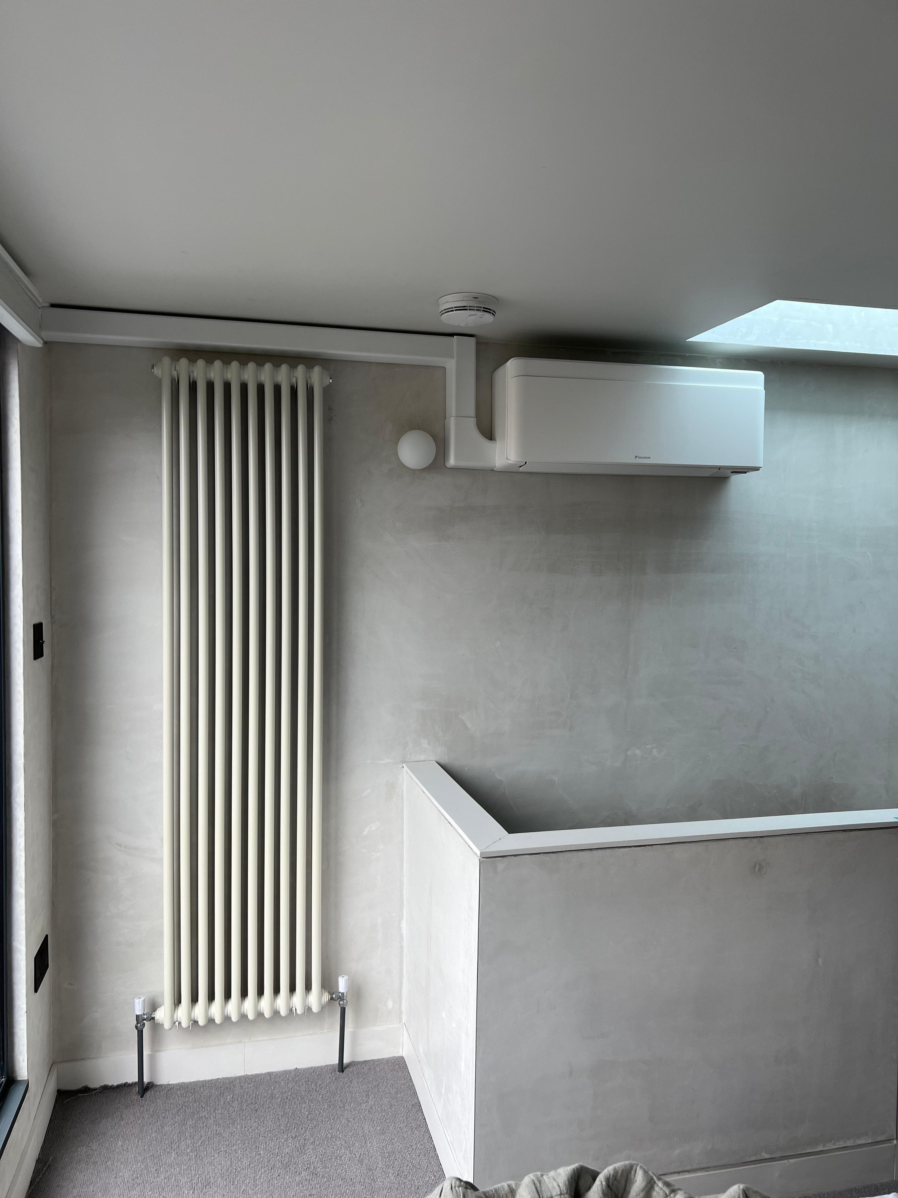 Daikin Stylish installed in a loft room with neat trunking run