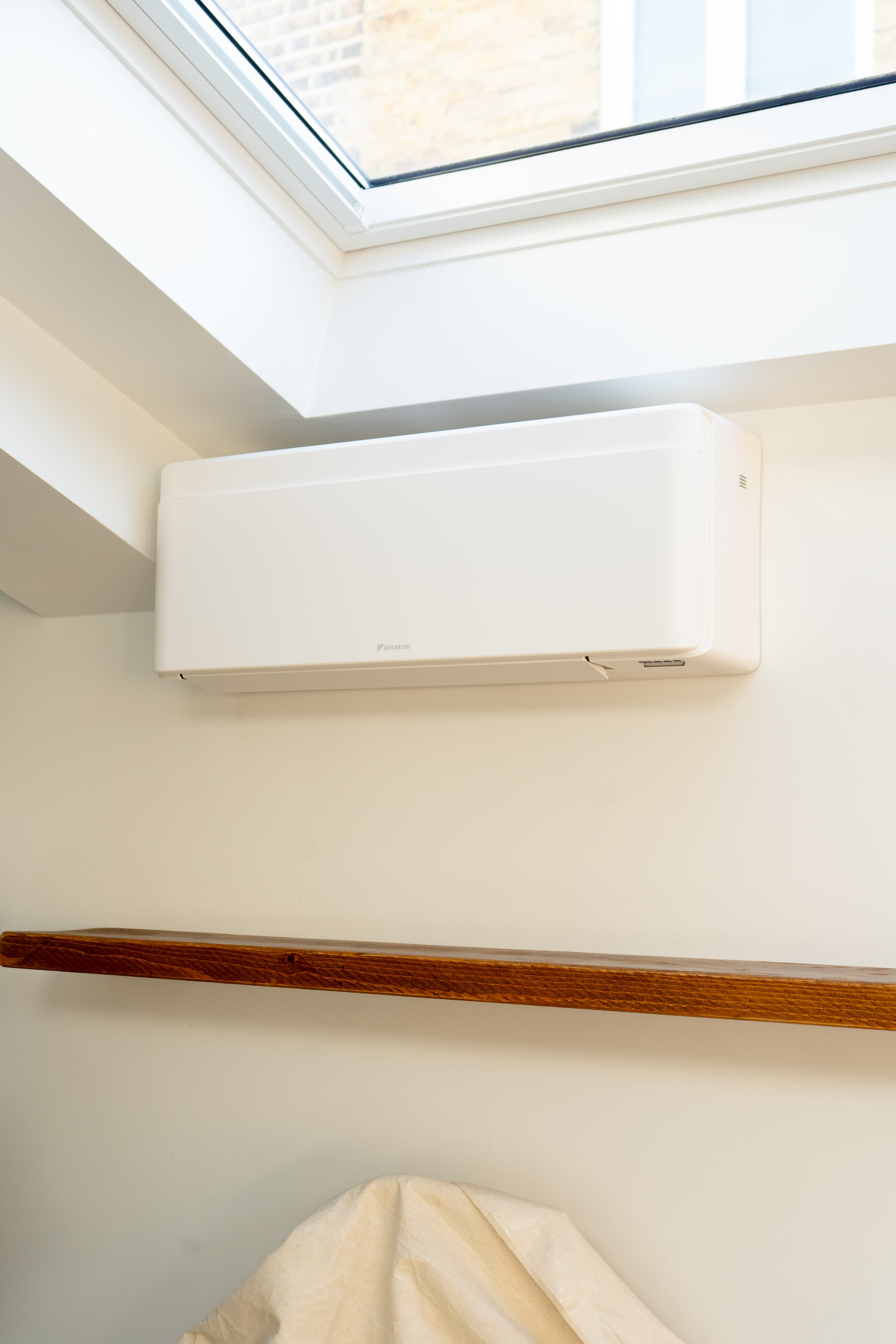 Daikin Stylish white unit installed on a light wall