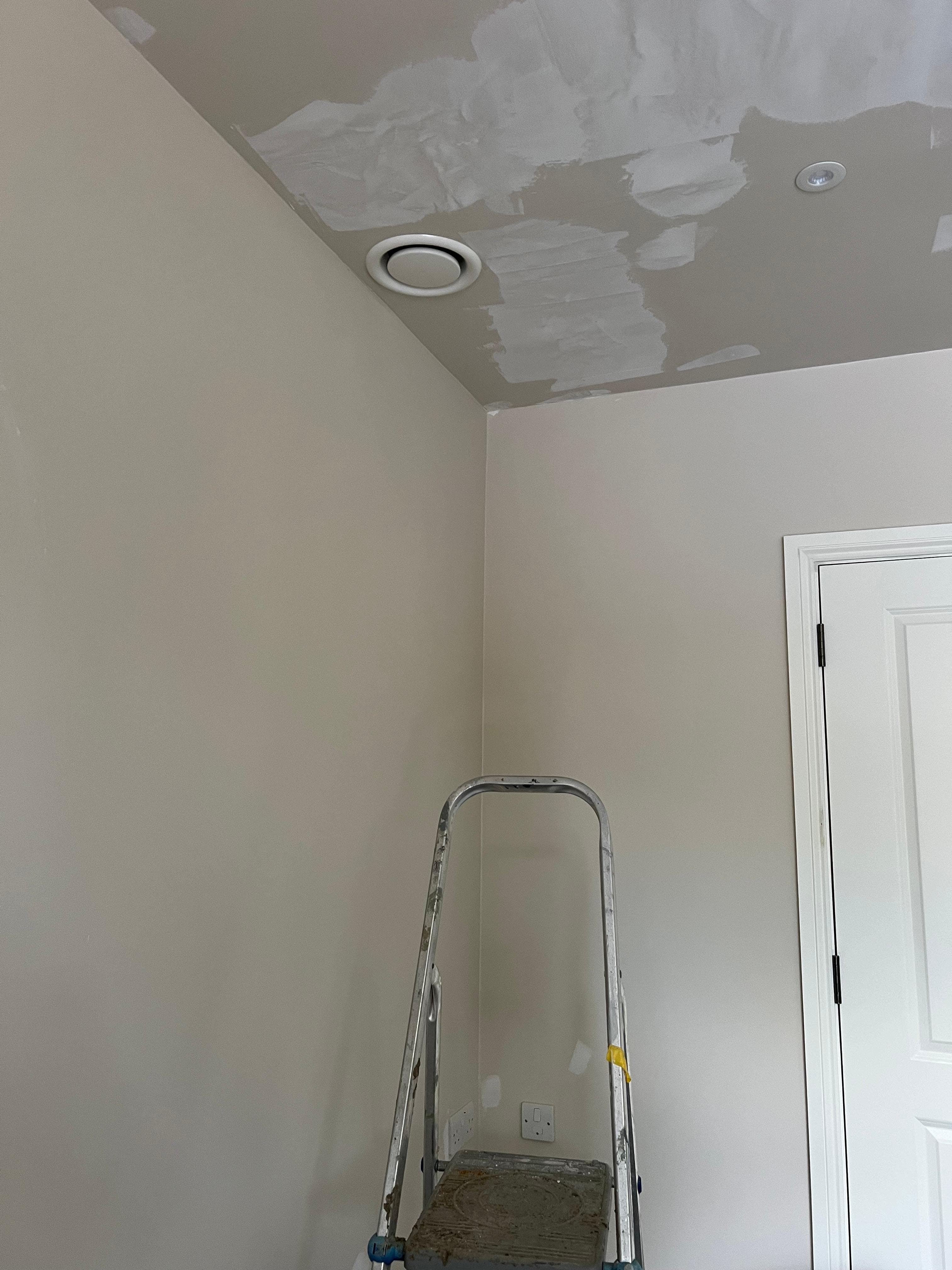 Ducted cassette unit with circular ceiling vent - commercial installation