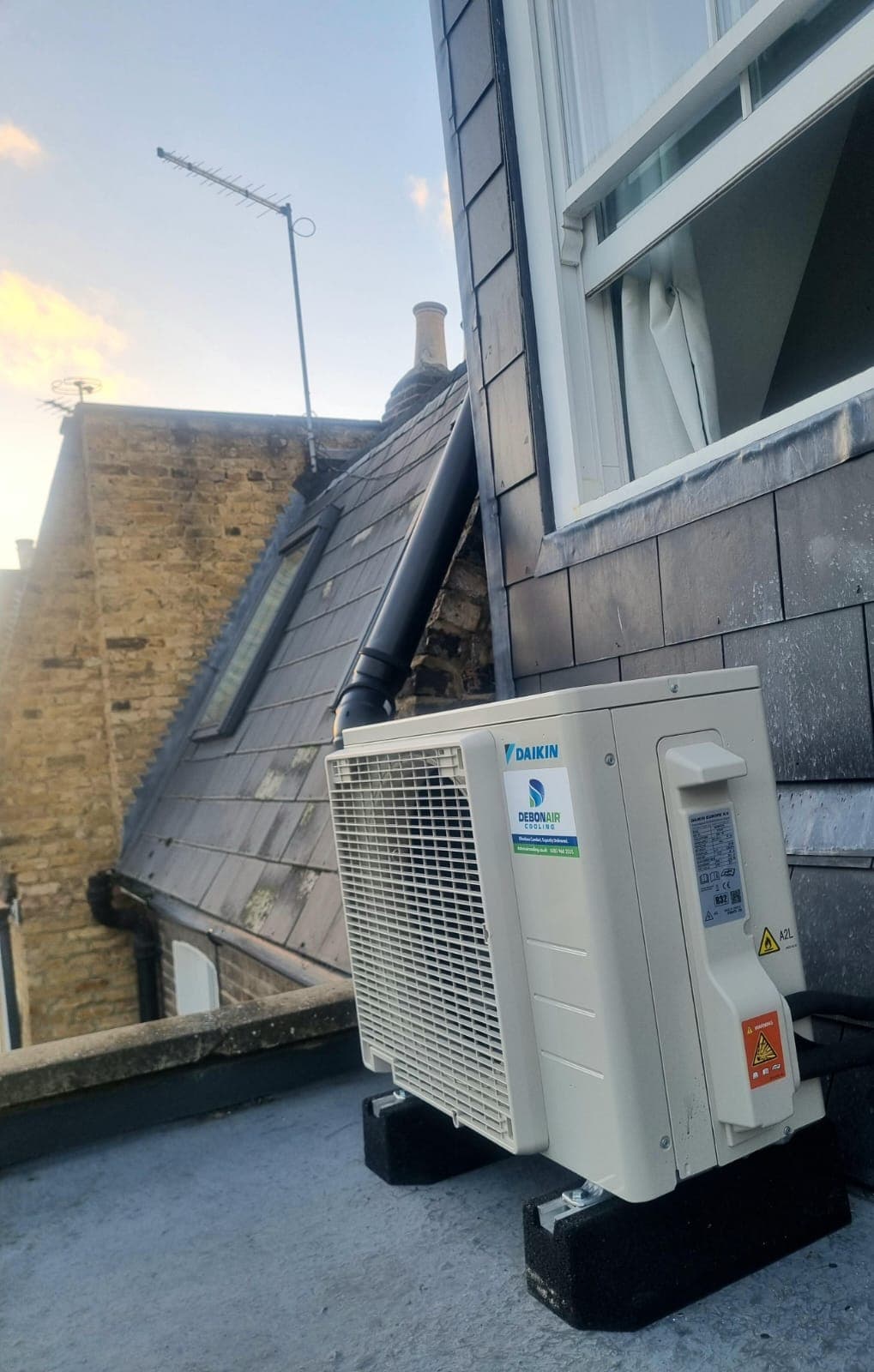 Condenser unit mounted on a flat roof