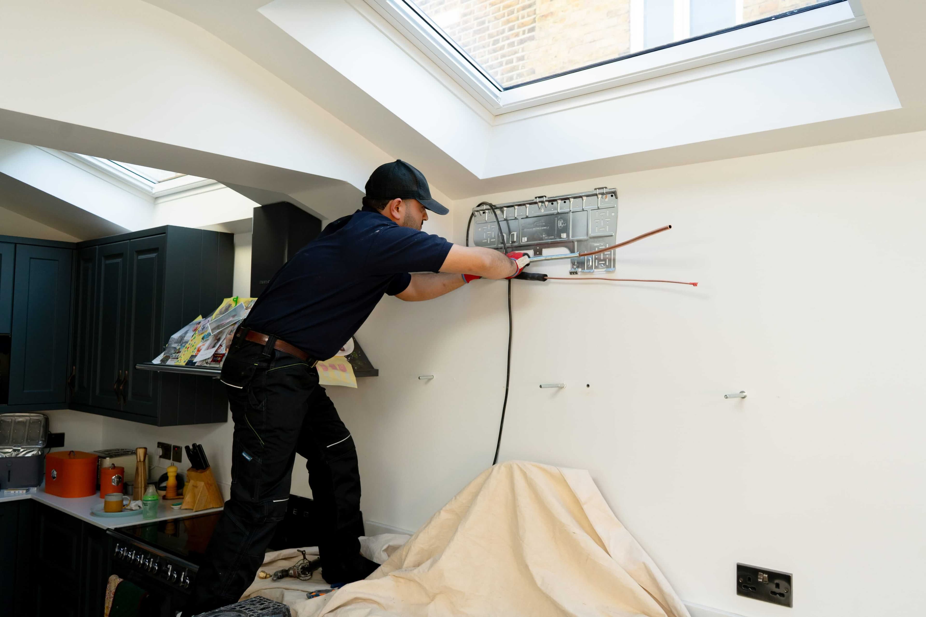 AC engineer working on an air conditioning system