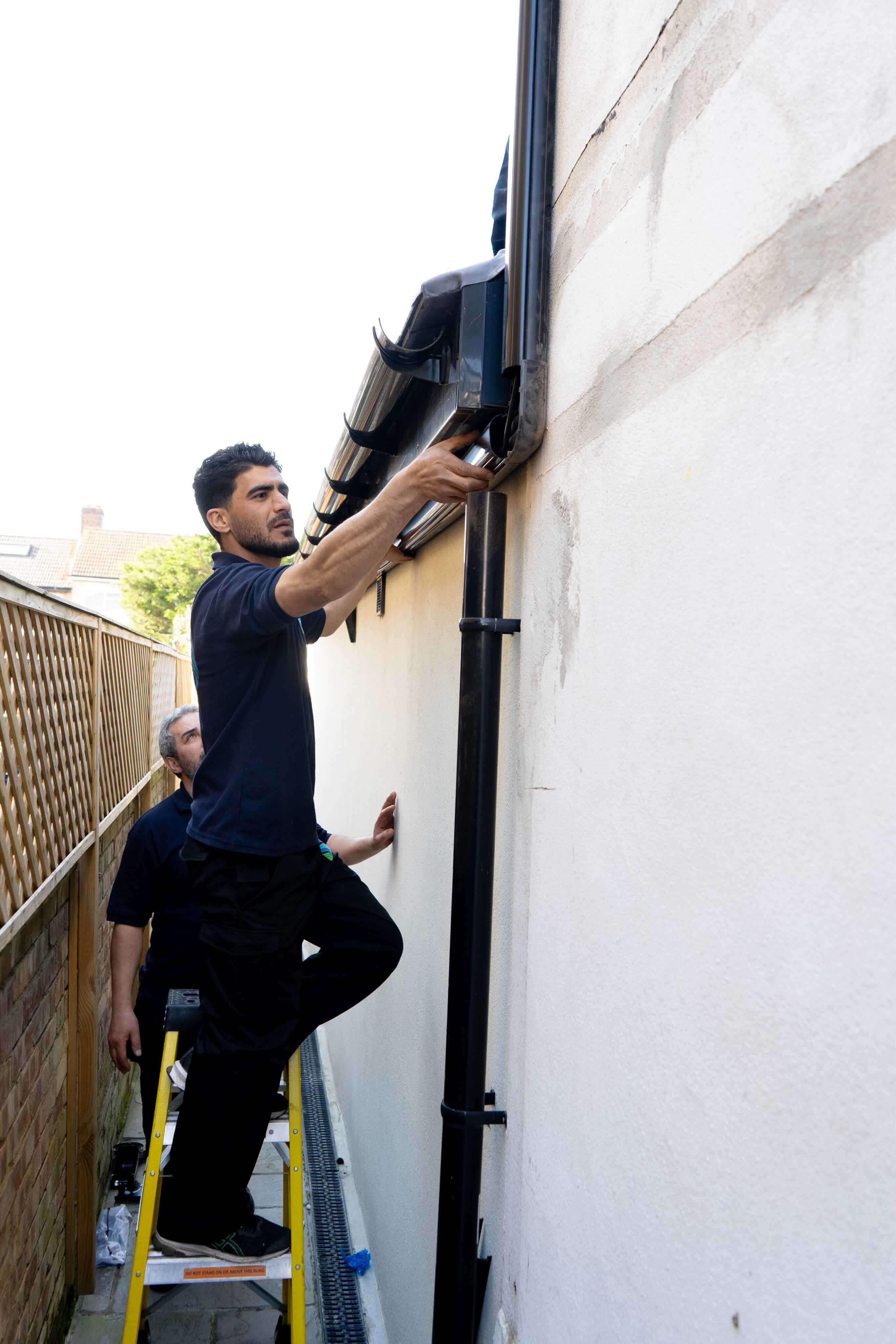 Engineer installing outdoor AC condenser unit