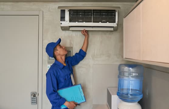 DebonAir engineer providing aftercare and servicing support for an air conditioning system