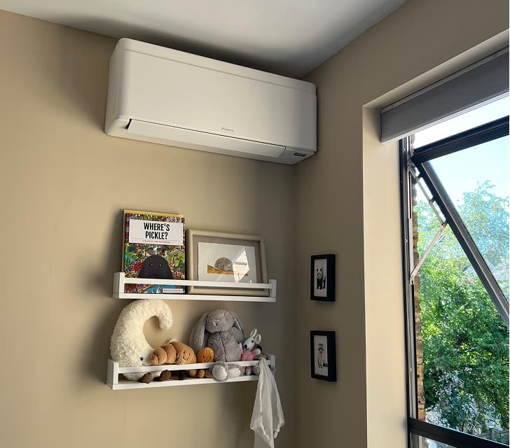 Installed wall-mounted air conditioning unit in a residential room