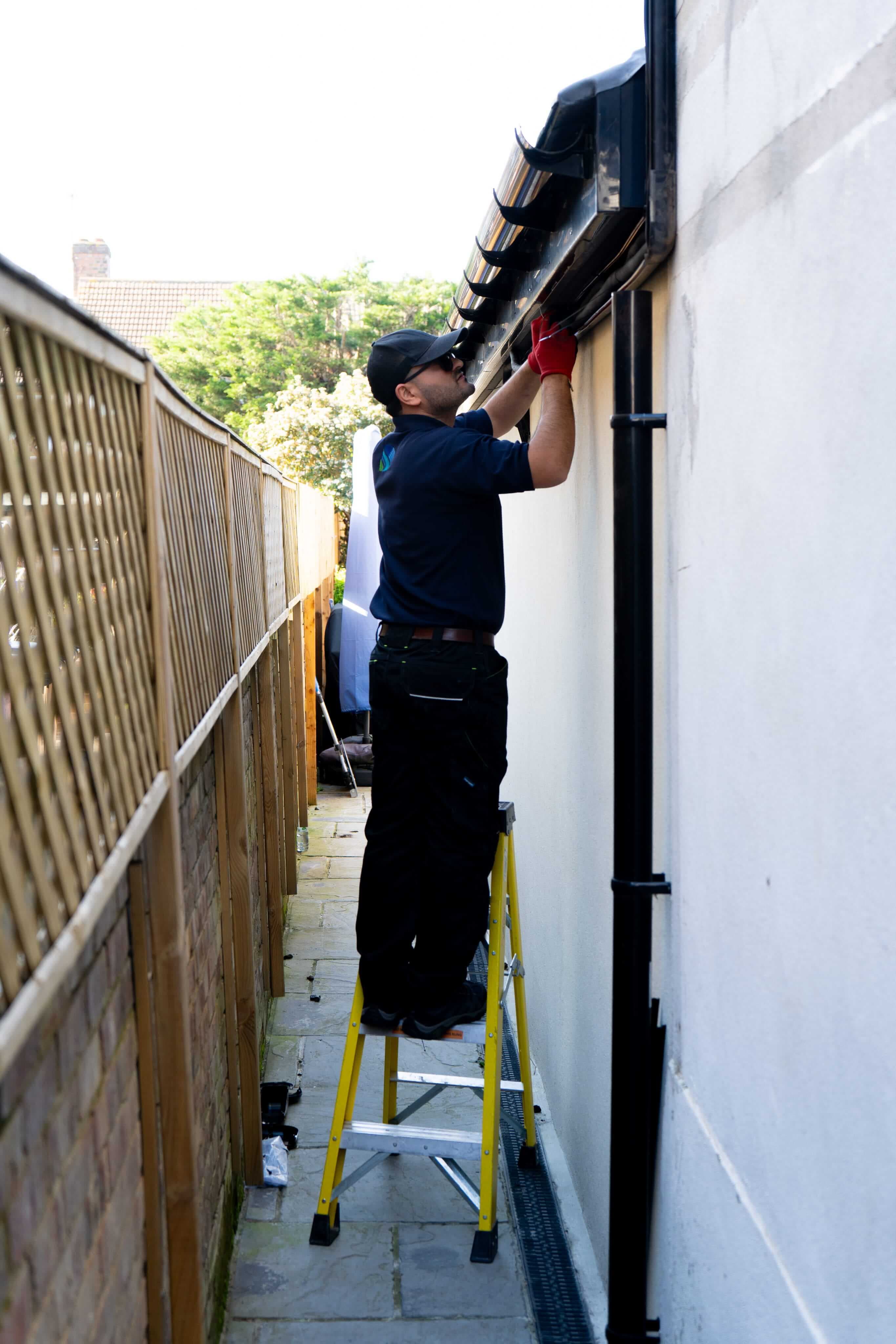 AC engineer inspecting an outdoor air conditioning unit