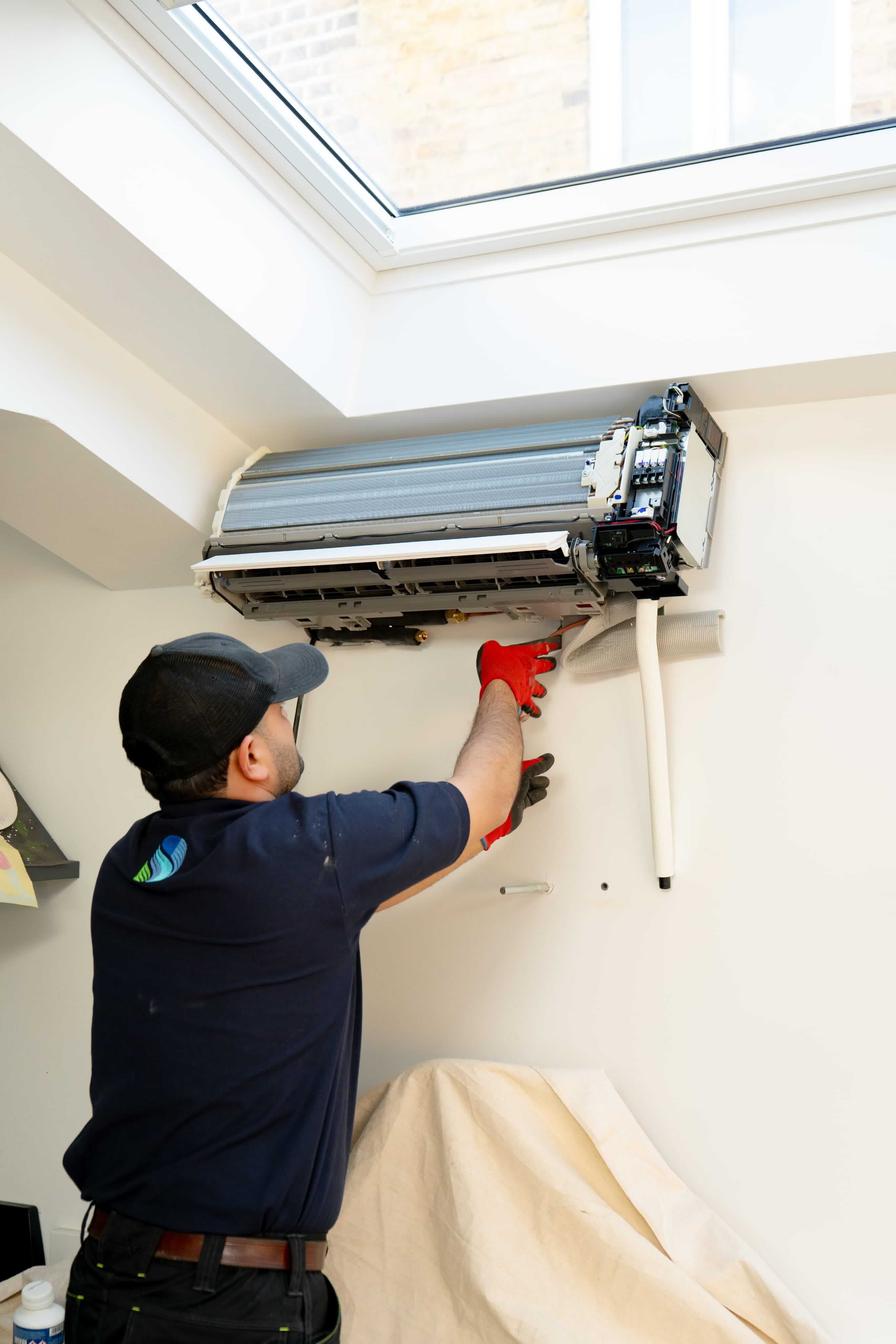 Wall-mounted air conditioning unit ready for repair service